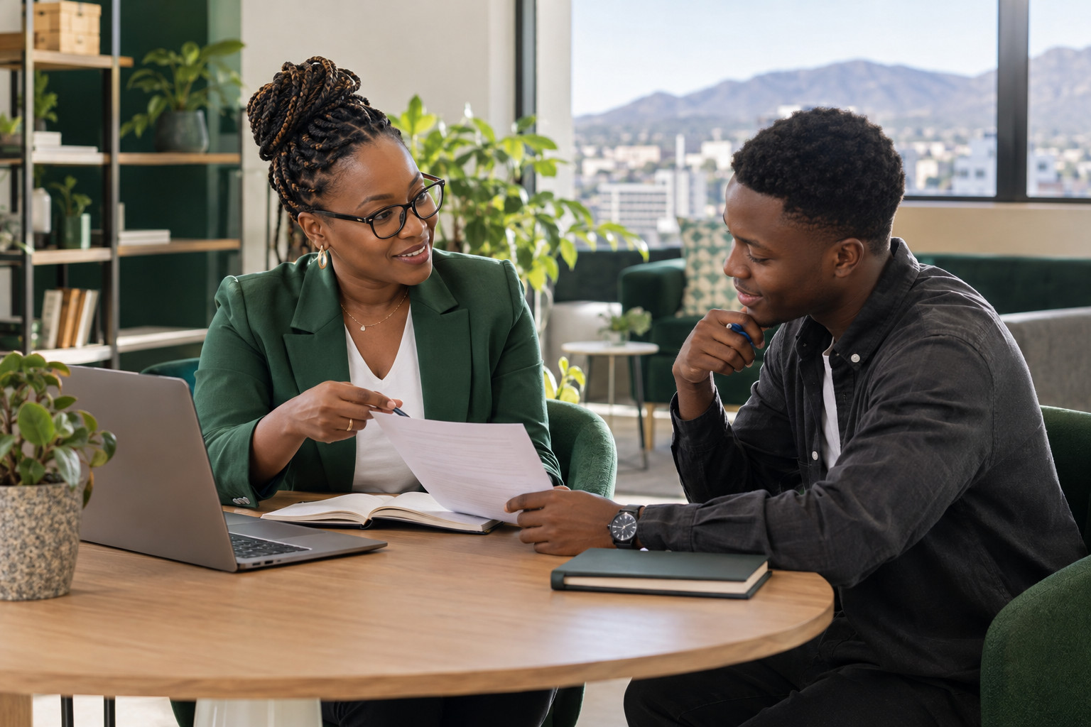 Career coach reviewing a CV with a young adult